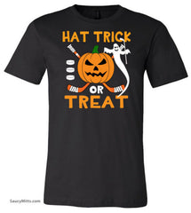 A black short-sleeve crewneck t-shirt featuring a Halloween graphic on the chest with the text 'HAT TRICK OR TREAT' in orange, a jack-o'-lantern, a white ghost, and crossed hockey sticks.
