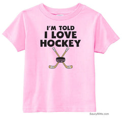 I'm Told I Love Hockey Toddler Shirt pink