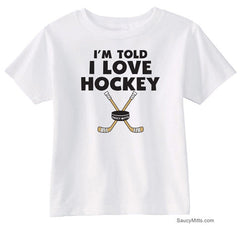I'm Told I Love Hockey Toddler Shirt white